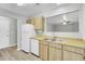 Well-equipped kitchen area with updated cabinets, stainless steel sink, dishwasher, and a view into the living space at 108 Greenmeadow Dr, Goose Creek, SC 29445