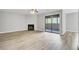 Inviting living room featuring a fireplace, ceiling fan, and sliding glass doors leading to an outdoor space at 108 Greenmeadow Dr, Goose Creek, SC 29445