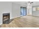 Bright living room with a fireplace and sliding doors, offering a cozy and well-lit space with access to outdoor views at 108 Greenmeadow Dr, Goose Creek, SC 29445