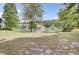 Enjoy the large grassy common area featuring a tranquil pond, perfect for picnics and outdoor activities at 108 Greenmeadow Dr, Goose Creek, SC 29445