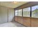 Enclosed screened porch with multiple windows and a lattice design, offering a private outdoor retreat at 108 Greenmeadow Dr, Goose Creek, SC 29445