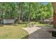 Spacious backyard featuring a patio, outdoor dining set, storage shed, and above-ground pool at 109 Williams Ct, Goose Creek, SC 29445