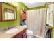 Bright bathroom with a vanity, mirror, and patterned shower curtain at 109 Williams Ct, Goose Creek, SC 29445