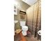 Cozy bathroom featuring a pedestal sink, toilet, and patterned shower curtain at 109 Williams Ct, Goose Creek, SC 29445
