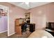 This bedroom features a ceiling fan, desk, and neutral color scheme at 109 Williams Ct, Goose Creek, SC 29445