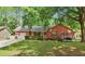 Traditional brick home with a welcoming front porch, swing, and well-manicured lawn at 109 Williams Ct, Goose Creek, SC 29445