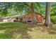 Quaint brick home with a cozy front yard swing, perfect for enjoying the outdoors at 109 Williams Ct, Goose Creek, SC 29445