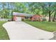 Charming brick home featuring a spacious driveway, attached garage, and well-maintained front yard at 109 Williams Ct, Goose Creek, SC 29445