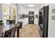 Bright kitchen with white cabinetry, modern appliances, and eat-in dining area near a large window at 109 Williams Ct, Goose Creek, SC 29445