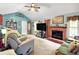Inviting living room with a brick fireplace, vaulted ceilings, and ample seating at 109 Williams Ct, Goose Creek, SC 29445
