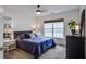 This bedroom features a ceiling fan, a bright window, and a plant filled dresser with a mirror at 113 Ashton Cv, Summerville, SC 29485