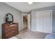 Bedroom with a dresser, mirror and large closet provides easy access to the landing and staircase at 113 Ashton Cv, Summerville, SC 29485