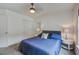 A well lit bedroom with ceiling fan, window and double closets at 113 Ashton Cv, Summerville, SC 29485