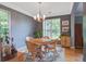 Cozy dining room with ample natural light, elegant chandelier, and room for Gathering gatherings at 113 Ashton Cv, Summerville, SC 29485