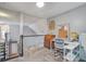 Upper floor landing with space for a home office, complete with desk, chair, and natural light at 113 Ashton Cv, Summerville, SC 29485