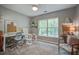 Inviting home office space with a window view, modern desk, and comfortable seating at 113 Ashton Cv, Summerville, SC 29485