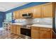 Well-equipped kitchen with wooden cabinets, stainless steel appliances, and stylish backsplash at 113 Ashton Cv, Summerville, SC 29485
