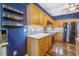Modern kitchen boasts light wood cabinets, stainless steel appliances, white countertops, and stylish backsplash at 113 Ashton Cv, Summerville, SC 29485