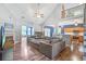 Open living room with vaulted ceilings, a cozy fireplace, and hardwood flooring at 113 Ashton Cv, Summerville, SC 29485