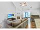 Comfortable living room featuring a fireplace, TV, aquarium, and a large sofa at 113 Ashton Cv, Summerville, SC 29485