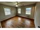 Bedroom featuring three windows with hardwood floor and ceiling fan at 113 Germantown Rd, Summerville, SC 29483