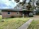 Charming single-story brick home with a covered porch and mature trees at 113 Germantown Rd, Summerville, SC 29483