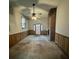 Living room featuring a fan, fireplace, wood paneling and front entrance at 113 Germantown Rd, Summerville, SC 29483