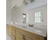 Bright bathroom featuring a double sink vanity with ample counter space and cabinet storage at 1150 Quick Rabbit Loop, Charleston, SC 29414