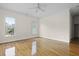 Bright bedroom with wood floors, white walls, and windows for natural light and neighborhood views at 1150 Quick Rabbit Loop, Charleston, SC 29414