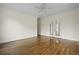 Spacious bedroom with polished wood floors and double doors, creating a light-filled living space at 1150 Quick Rabbit Loop, Charleston, SC 29414