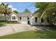 Inviting home with a quaint front porch, well-manicured landscaping, and spacious driveway at 1150 Quick Rabbit Loop, Charleston, SC 29414