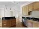 Efficient kitchen showcasing a central island with cooktop, hardwood floors, and stainless steel appliances at 1150 Quick Rabbit Loop, Charleston, SC 29414