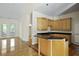 Open concept kitchen with a breakfast bar, hardwood floors, and stainless appliances at 1150 Quick Rabbit Loop, Charleston, SC 29414
