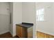Functional laundry area features storage cabinets and a window, providing natural light at 1150 Quick Rabbit Loop, Charleston, SC 29414