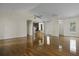 Open-concept living space with gleaming hardwood floors, high ceilings, and a seamless flow to the kitchen at 1150 Quick Rabbit Loop, Charleston, SC 29414