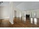 Bright living room featuring hardwood floors, a fireplace, and high ceilings with large windows at 1150 Quick Rabbit Loop, Charleston, SC 29414