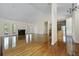 Spacious living room with vaulted ceiling, fireplace, gleaming hardwood floors, and open floor plan at 1150 Quick Rabbit Loop, Charleston, SC 29414