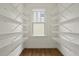 Spacious pantry with wooden floors and metal shelving providing ample storage space at 1150 Quick Rabbit Loop, Charleston, SC 29414
