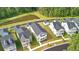 An aerial view of a community of homes near a pond surrounded by beautiful green trees at 117 Osprey Ridge Ln, Summerville, SC 29483