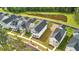 Aerial view of a community with well-manicured lawns and a serene pond at 117 Osprey Ridge Ln, Summerville, SC 29483