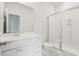 Well-lit bathroom with a white vanity, toilet, and glass-enclosed shower at 117 Osprey Ridge Ln, Summerville, SC 29483