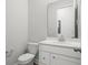 Bathroom featuring white vanity, toilet, mirror and modern fixtures at 117 Osprey Ridge Ln, Summerville, SC 29483