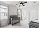 Bright bedroom with a grey crib and change table, a window and ensuite bathroom at 117 Osprey Ridge Ln, Summerville, SC 29483