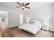 Cozy bedroom features a queen bed, hardwood floors, ceiling fan, and modern furniture at 117 Osprey Ridge Ln, Summerville, SC 29483