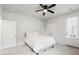 Cozy bedroom featuring neutral colors, ceiling fan, and door to balcony at 117 Osprey Ridge Ln, Summerville, SC 29483