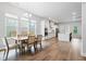 Open dining area featuring a modern chandelier and hardwood floors at 117 Osprey Ridge Ln, Summerville, SC 29483
