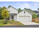 A beautiful two-story home, complemented by an attached garage and lush landscaping at 117 Osprey Ridge Ln, Summerville, SC 29483