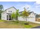 Charming two-story home featuring a spacious backyard and attached garage at 117 Osprey Ridge Ln, Summerville, SC 29483