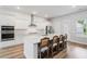 Beautiful kitchen with stainless steel appliances, large island with seating and light hardwood floors at 117 Osprey Ridge Ln, Summerville, SC 29483