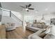 Spacious living room with an open floor plan, a ceiling fan, and plenty of natural light at 117 Osprey Ridge Ln, Summerville, SC 29483